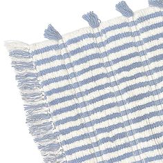 four blue and white striped rugs with tassels on each side, set against a white background