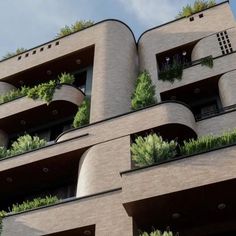 an architectural building with plants growing on the balconies