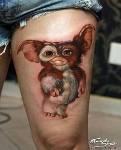 a woman's thigh with an image of a small monkey on the thighs and legs