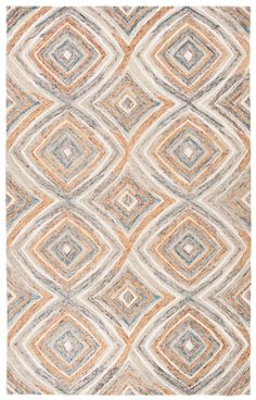 an orange, grey and white rug with squares on it's sides in different colors