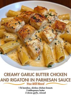 a white plate topped with pasta and chicken