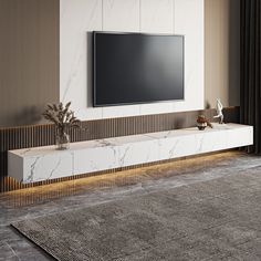 a large flat screen tv mounted to the side of a wall in a living room