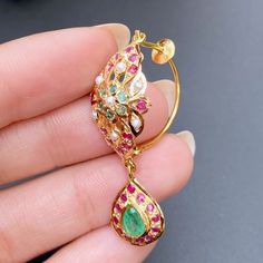 Traditional jadau earrings in 22ct hallmarked gold. It has been embellished with rubies, emeralds and pearls. It weighs 7.80 GMs Price Breakup Summary Component Rupees % of Total 22k Gold 37,997 76.2% Stones & Beads 2,603 5.2% Making Charges 6,839 13.7% Taxes (GST) 1,423 3.0% Total 49,862 100.0% View Detailed Price Breakup Jadau Jwellery, Jadau Earrings, 22k Gold Jewelry Necklaces, Chand Bali, 22k Gold Earrings, Jewel Earrings, Rajputi Jewellery, Gold Jhumka, Wedding Jewelery