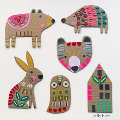 wooden cut outs with animals and houses on them