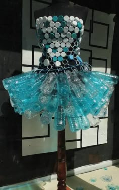 a mannequin made out of plastic bottles