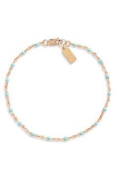 Round enamel beads intersperse bits of color on this delicate chain bracelet handcrafted from 14-karat-gold fill. 7" length Lobster clasp closure 14k-gold fill/enamel Made in the USA Elegant Turquoise Beaded Chain Bracelet, Turquoise Bracelet With Gold Beads, Everyday Hand-strung Turquoise Bracelet, Casual Turquoise Hand-strung Stretch Bracelet, 14k Gold Multi-stone Turquoise Jewelry, Southwestern Turquoise Hand-strung Bracelets, On Set, Chain Bracelet, Gold Filled