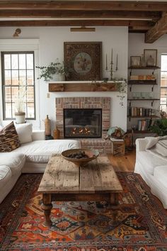 a living room filled with furniture and a fire place in the middle of a room