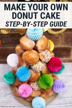 a cake made out of doughnuts with the words make your own donut cake step - by - step guide