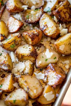 potatoes with parmesan cheese in a baking pan