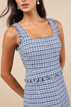 It's easy to become a style icon with pieces like the Lulus Adorably Luxurious Blue Tweed Raw Edge Sleeveless Mini Dress! Woven tweed fabric, with a blue, white, and black design throughout, shapes tank straps and a flattering square neckline. Darted bodice continues down to a fitted waist, atop a lightly flaring skirt with a flounce-trimmed mini hem. Raw-edge trim at the arms and waist completes the look. Hidden zipper/clasp at back. Fit: This garment fits true to size. Length: Mid-thigh. Size Chic Blue Tweed Summer Dress, Fitted Sleeveless Tweed Summer Dress, Sleeveless Blue Tweed Dress For Spring, Blue Sleeveless Tweed Dress For Spring, Fitted Blue Tweed Summer Dress, Blue Fitted Tweed Dress For Summer, Fitted Blue Tweed Dress For Summer, Fitted Sleeveless Tweed Dress, Blue Tweed Dress For Spring