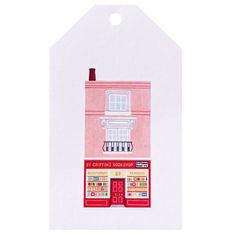 a paper cutout of a pink building with a red roof and windows on the front