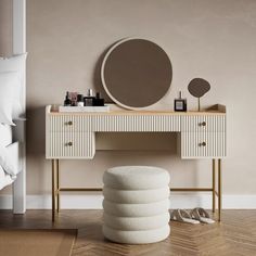 a bedroom with a vanity and mirror on the wall next to a white stool in front of it