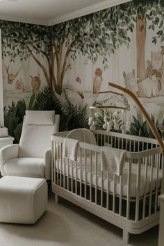 a baby's room with a white crib, chair and wall mural in the background