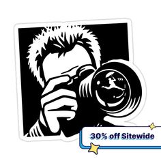 a sticker with the image of a man holding a camera in front of his face