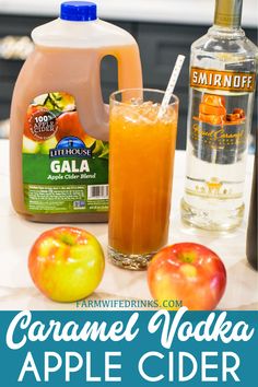 caramel vodka and apple cider are on the counter with apples, oranges, and other ingredients