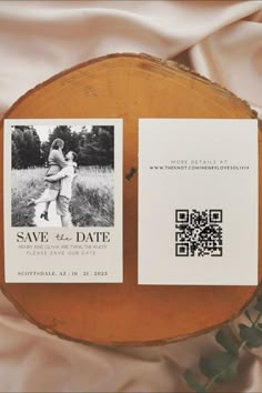 Light pink satin backdrop features a sprig of eucalyptus and a rustic wood platter supporting a neutral-toned Save the Date card. Card design features large, sleek serif font with the words "Save the Date" displayed clearly under a black and white photo of a man and woman embracing happily in a field. The words "Henry and OIivia are typing the knot! Please save our date. Scottsdale, AZ, 10, 21, 2023" below. Card Side B: "More details at [wedding website URL], with a QR code image below." Easy Save The Dates, Save The Date Ideas Canva, Diy Save The Date Cards, Rustic Wedding Save The Date Ideas, Save The Day Ideas, Wedding Save The Date Ideas Unique, Save The Date Aesthetic, Save The Date Ideas Photos, Rustic Save The Date Ideas