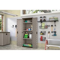 a garage storage cabinet with shelves and tools