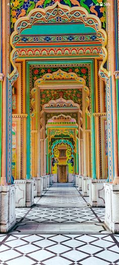 an intricately painted building with columns and arches