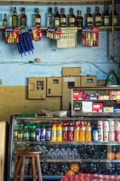 an assortment of drinks and condiments on display in a store