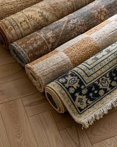 several rugs laid out on the floor together