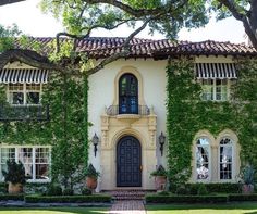 a house covered in vines and ivys