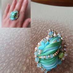 there is a ring with beads and pearls on it