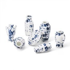 several blue and white vases sitting next to each other