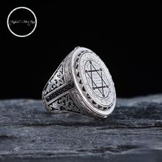 The Seal of Solomon model is with you with its strong and noble appearance...  In our model, which we have carefully prepared with the special design of 'SEAL OF SOLOMON', the sides are decorated with black zirconium stones with motifs and the seal of HZ Solomon is engraved on the upper part. What is the Seal of Prophet Solomon?  The ring on which this seal was engraved was first used by Hazrat Adam (a.s.) and left it in heaven when he brought it to earth, and then was given to the Prophet by Ha Prophet Solomon, Hazrat Adam, Solomons Ring, Zirconium Ring, Black Zirconium Ring, Seal Of Solomon, Turkish Rings, Jewish Symbols, King Ring