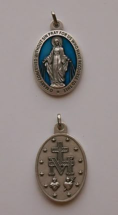 "This beautiful medal of The Miraculous Virgin is made in Italy and finished in Silver Tone and blue color enamel. The finish of this medal is of a very good quality.  Most people use it when going to church or just for looks. SIZE: Medal is oval in shape and measures 1-1/2\" x 1-1/8\". Can be used with any necklace that you like. MEDAL: Beautiful image of The Miraculous Virgin (Our Lady of Grace). Picture shows the two sides of the medal. FINISH: Silver Tone alloy and blue color enamel. NOTE: T Medals Wallpaper, Our Lady Of The Miraculous Medal, Grace Picture, Our Lady Of Miraculous Medal, Our Lady Of Grace, Going To Church, Mama Mary, Queen Of Heaven, Blessed Mother Mary