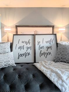 two framed signs sitting on top of a couch in front of a window with the words i wish so i could love you longer