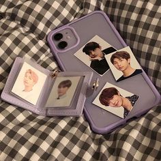 an iphone case with pictures of people on it and a keychain attached to the back