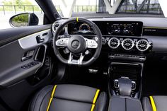 the interior of a car with black and yellow trims