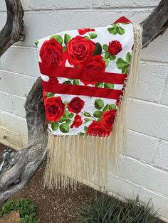 A child's dance shawl . Cotton material with vibrant roses about a yard and half long and about 35 inch wide  . This is shawl is folded in half in this picture and also unfolded. it is about 1 and a quarter long.  Decorated with red ribbon that has pinstripe sparkle adorning the ribbon.  Fringe is soft cream color about 12 inches long. Independence Mo, Native Dress, Ribbon Skirts, Des Roses, Red Ribbon, Shawls And Wraps, Cream Color, Scarf Wrap, Random Stuff