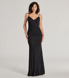 a woman in a long black dress