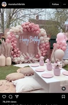 an outdoor birthday party with balloons and decorations