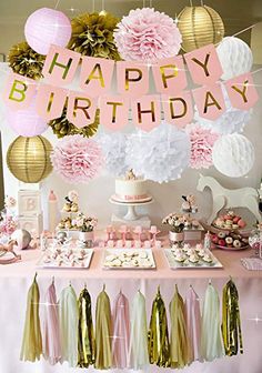 a birthday party with pink and gold decorations