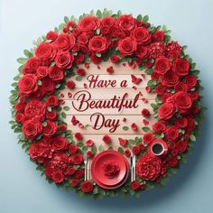 red roses arranged in a circle with the words have a beautiful day