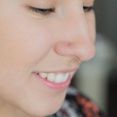 a close up of a person with a cell phone in their hand and her eyes closed