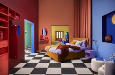 a bedroom with colorful walls and flooring, including a bed in the foreground