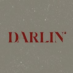 the word darlin written in red on a gray background