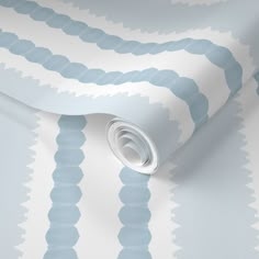 a blue and white wallpaper with wavy lines on the side, in an abstract pattern