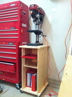 a workbench and toolbox are sitting next to each other