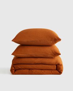 three pillows stacked on top of each other