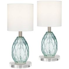 two green glass table lamps with white shades