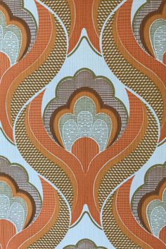 an orange and brown wallpaper with wavy designs on it's sides, in the style of art nouveauism