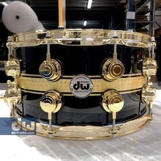 a black and gold drum is on display