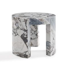 a white marble side table with black and grey designs on the top, sitting in front of a white background