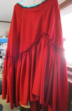 "Vintage Renowned Designer Helen Pons Costume Skirt, Red with tiered ruffle, length is 42\", waist opening is  28\" with additional hooks to make it smaller.  Fabric feels like a rayon.   In ok shape.  Lots of stains on the bottom of the hem.  Part of the opening in the back is ripped and some small holes, one area on hem is ripped.   Inside is lined with black organza.    Unique skirt with the tag \"Miss Shalit\" Baker.    Not sure if the character is a Baker or Miss Shalit.  Probably made in the 50s, 60s, her career is outlined on the internet.   Born 1897 and died 1990." Unique Skirt, Unique Skirts, Nice Belts, The 50s, Vintage Magazine, Cute Designs, The Internet, Vintage Ladies, Career