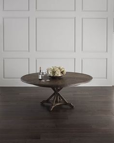 a wooden table with two wine glasses on it