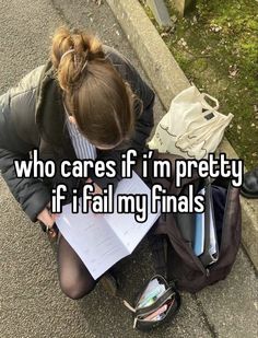 a woman sitting on the ground with her backpack and papers